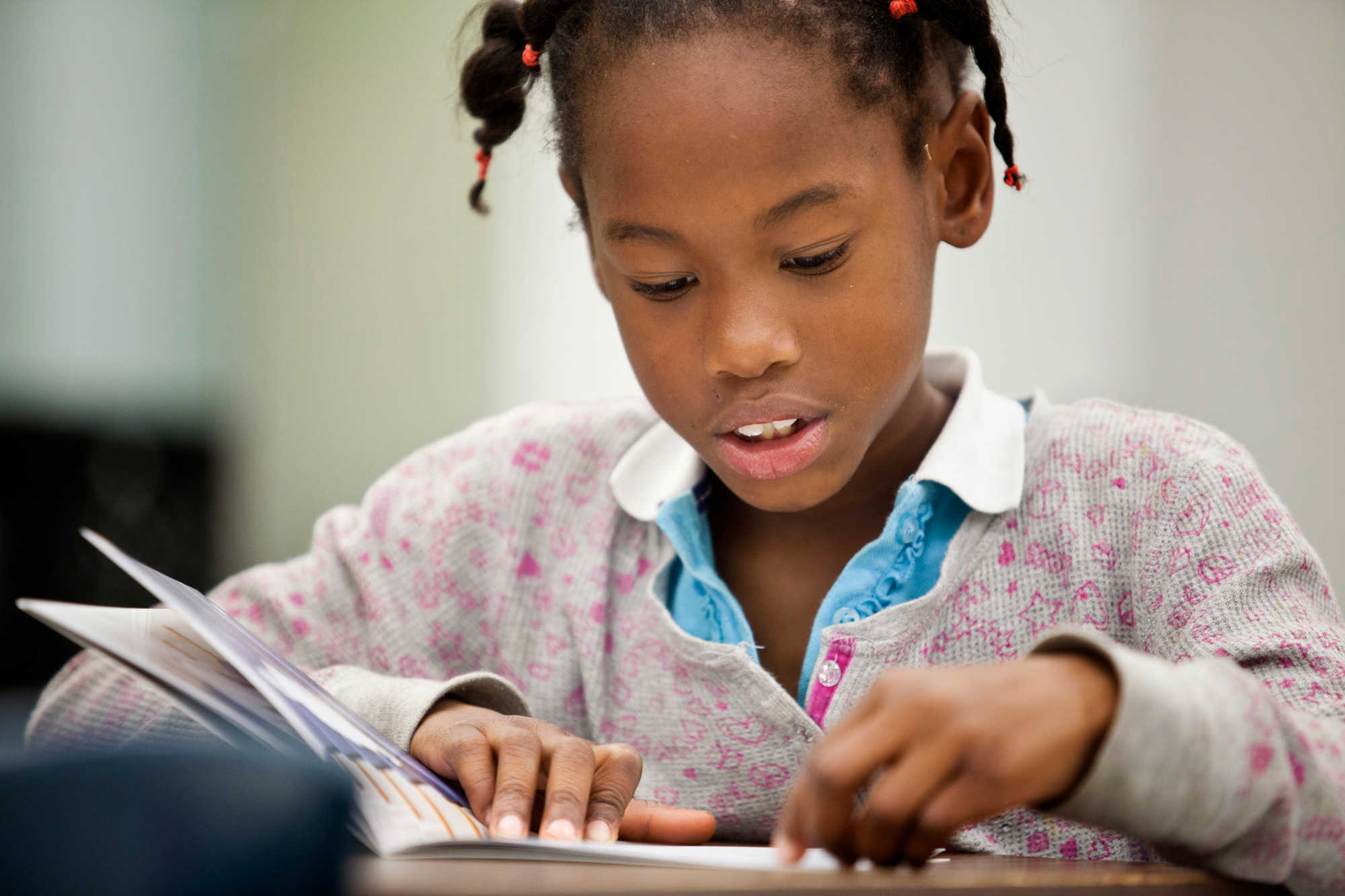 Girl reading book. 