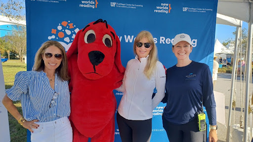 Several members of Friends of Manatee Lagoon pose with Clifford at a New Worlds Reading event.